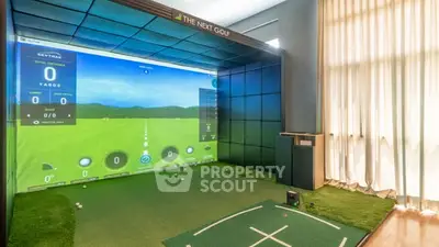 Luxurious indoor golf simulator room with advanced technology and modern design