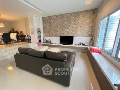 Spacious modern living room with sleek design and ample natural light
