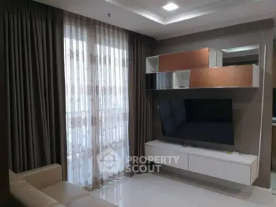 Modern living room with stylish TV unit and elegant curtains
