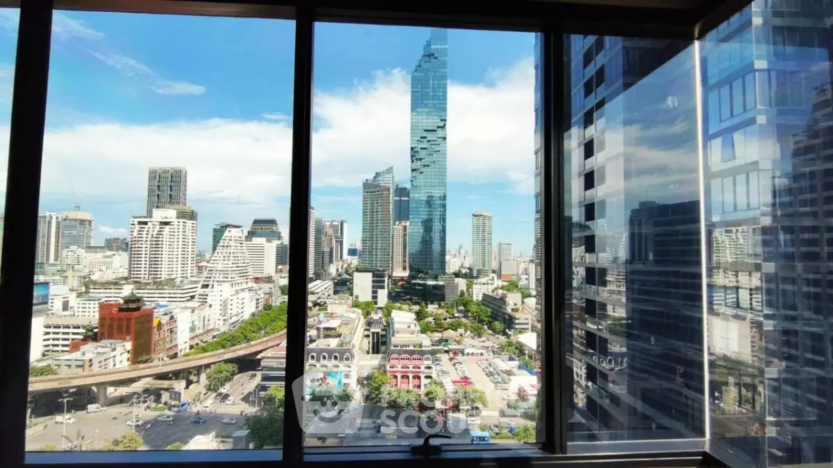Stunning cityscape view from high-rise building window showcasing urban skyline.