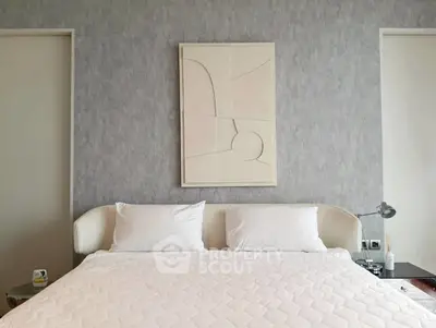 Modern bedroom with stylish decor and cozy bedding