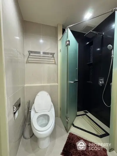 Modern bathroom with glass shower and sleek fixtures