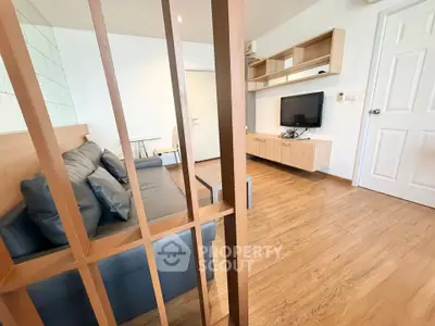 Modern living room with wooden flooring and stylish furniture