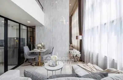 Luxurious modern living room with high ceilings and elegant decor