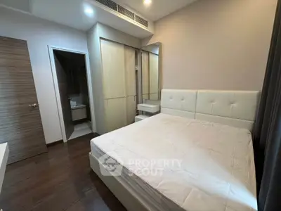 Modern bedroom with ensuite bathroom and stylish decor