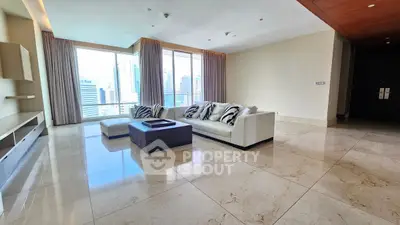 Spacious modern living room with city view and elegant marble flooring.