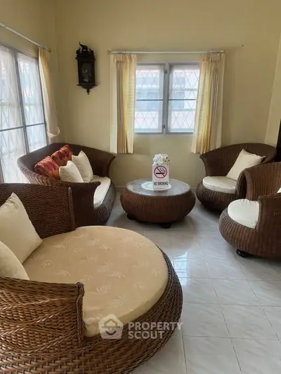 Cozy living room with wicker furniture and natural light