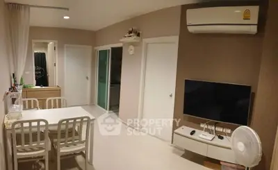 Modern living room with dining area and air conditioning in cozy apartment