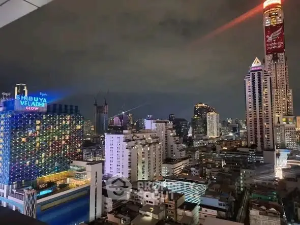 Stunning cityscape view showcasing vibrant skyscrapers and urban lights at night.