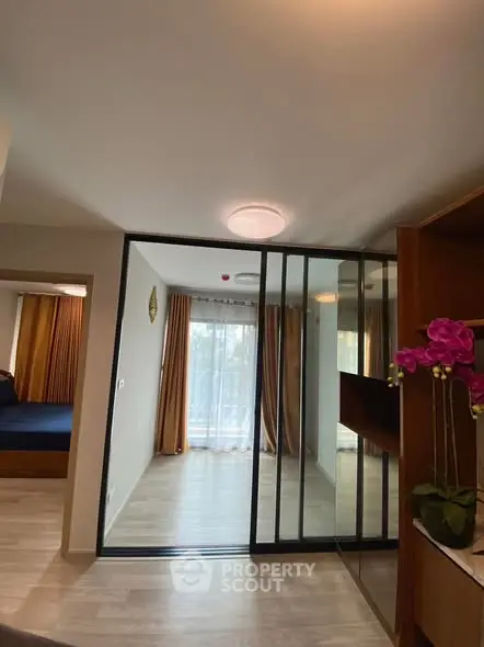 Modern living room with sliding glass doors and elegant decor