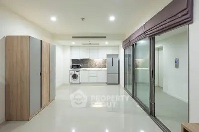 Modern open-plan kitchen with sleek appliances and ample storage space