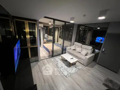 Modern living room with glass partition and cozy bedroom view