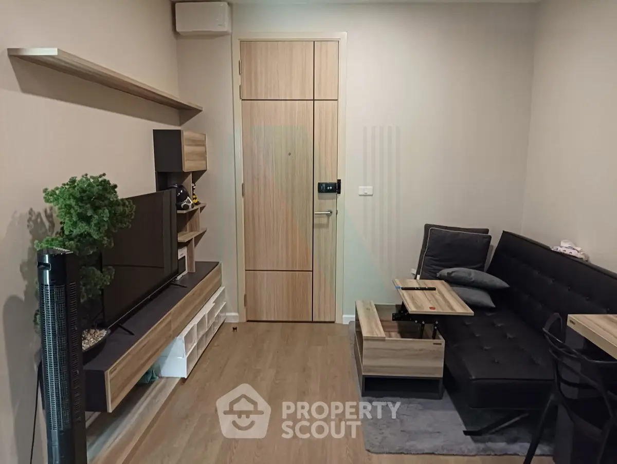 Modern living room with sleek furniture and wooden accents, perfect for cozy urban living.