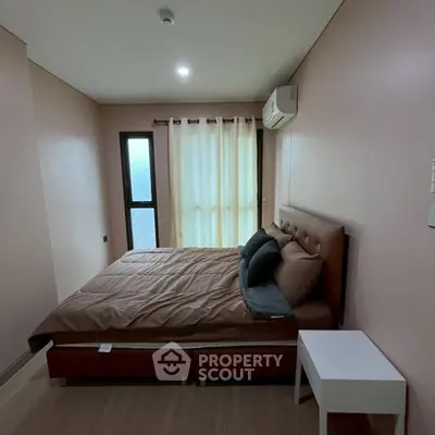 Cozy bedroom with modern furnishings and natural light