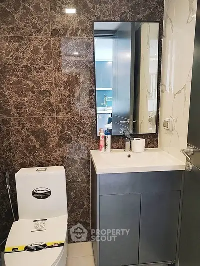 Modern bathroom with sleek design and marble accents