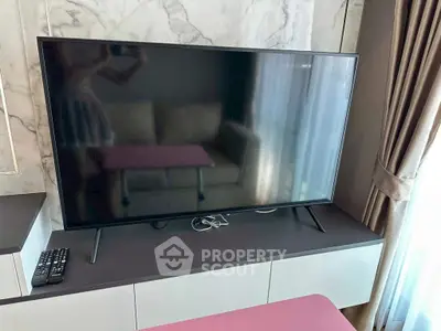 Modern living room with sleek TV and elegant decor