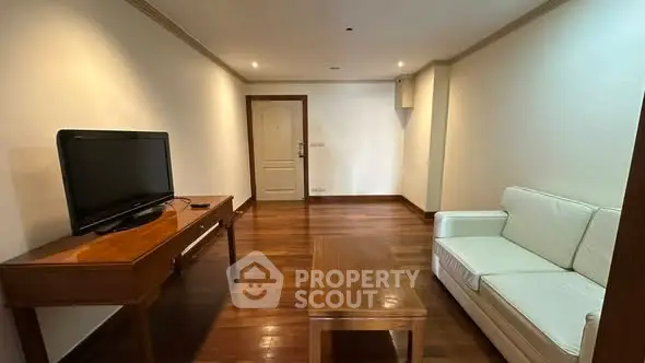 Spacious living room with wooden flooring and modern furniture