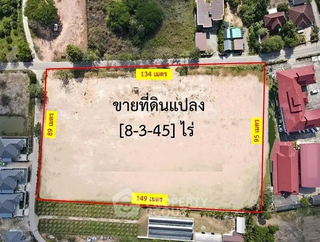 Prime land plot for sale with clear boundaries and dimensions in a developing area.
