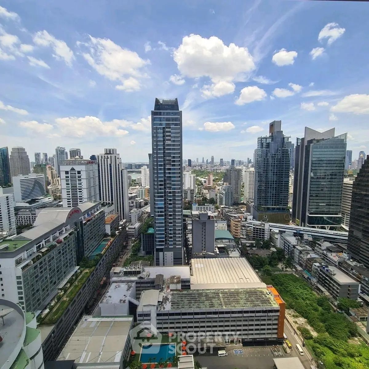 Stunning cityscape view showcasing modern skyscrapers under a clear blue sky.