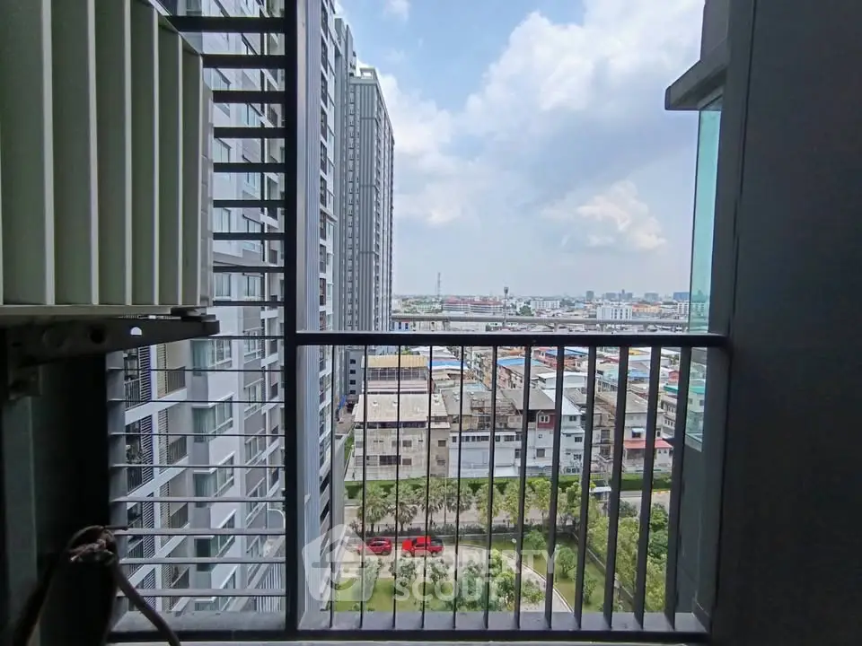Stunning cityscape view from a high-rise balcony, perfect for urban living enthusiasts.