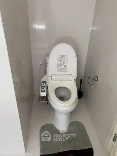 Modern bathroom with high-tech toilet and sleek design