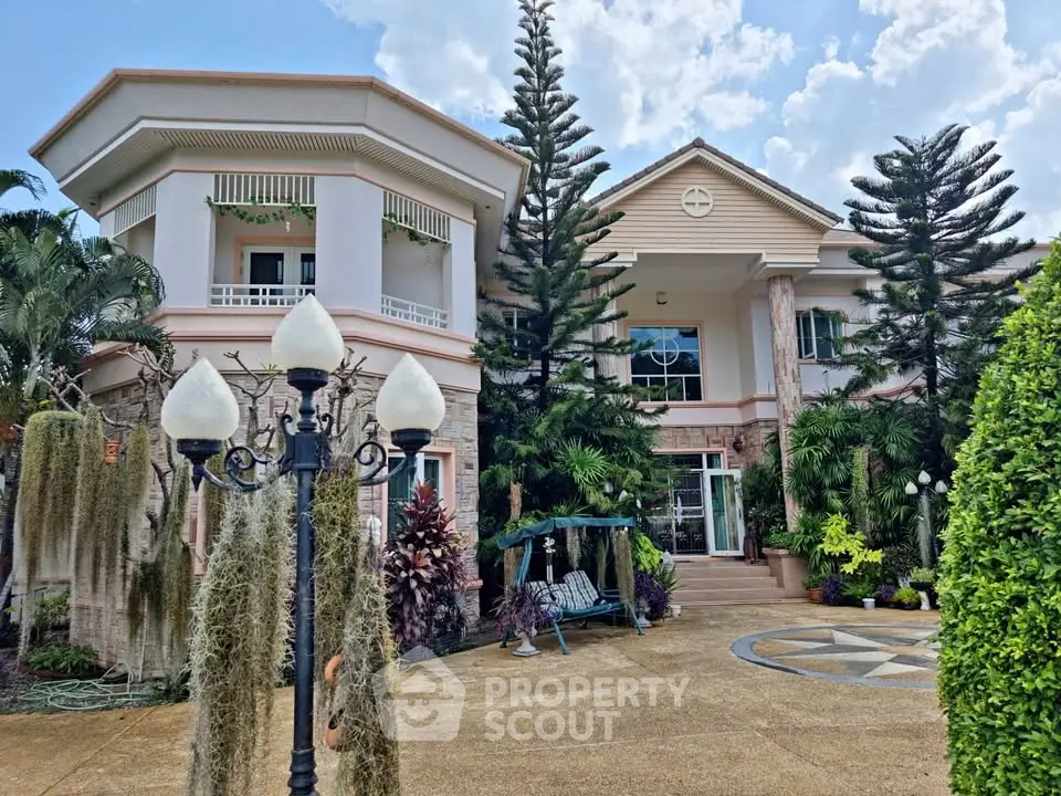 Stunning two-story house with lush garden and elegant architecture.