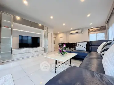 Spacious modern living room with sleek furniture and elegant decor