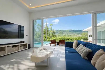 Luxurious living room with stunning mountain view and pool access