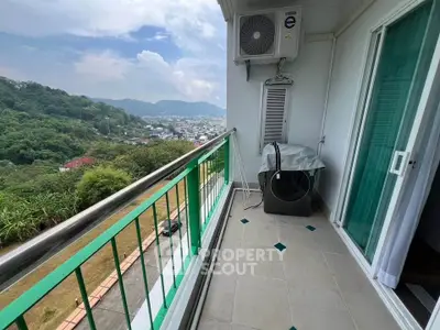 Spacious balcony with scenic mountain view and air conditioning unit