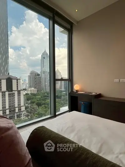 Luxurious bedroom with stunning city view from floor-to-ceiling windows, modern decor and ambient lighting.