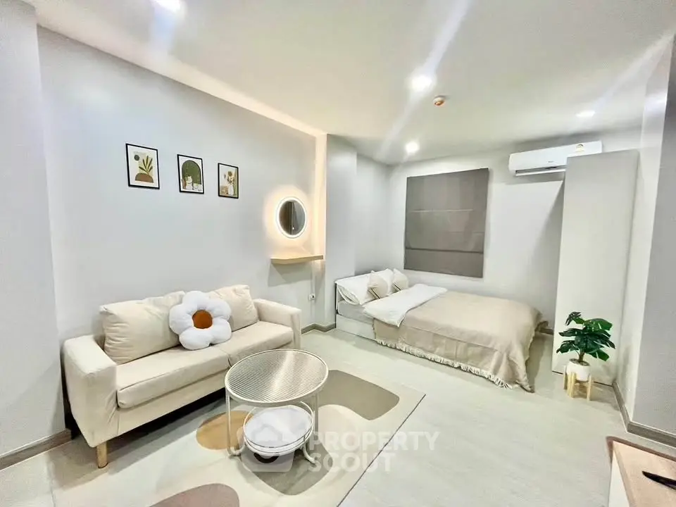Modern studio apartment with cozy living area and stylish decor