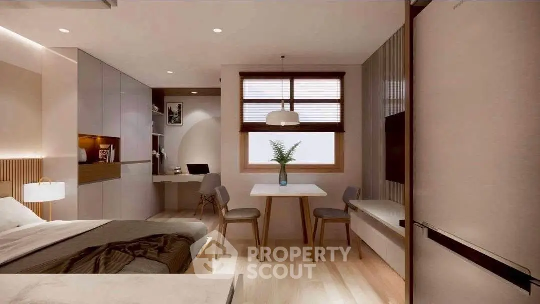 Modern bedroom with study area, featuring sleek furniture and natural lighting.
