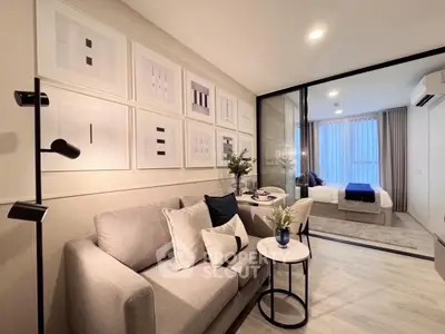 Modern living room with stylish decor and cozy ambiance in a contemporary apartment.
