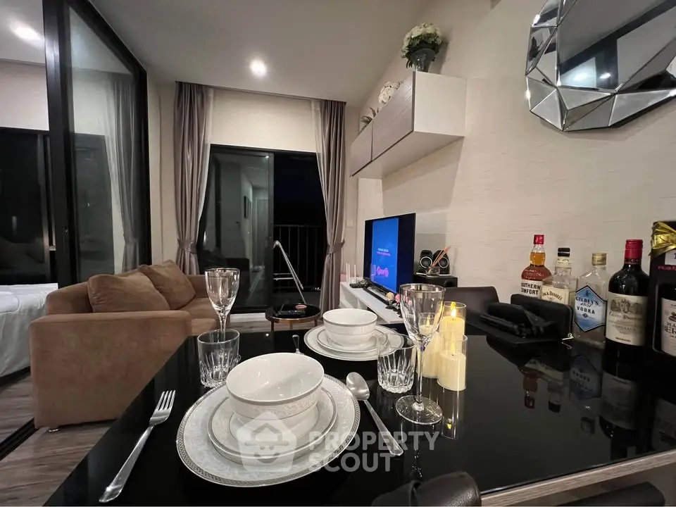 Modern living room with elegant dining setup and stylish decor