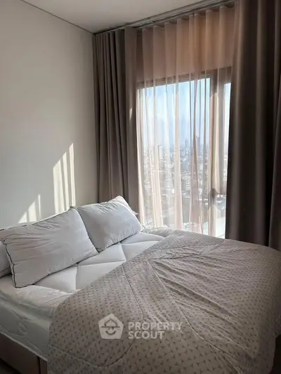 Cozy bedroom with city view and elegant curtains