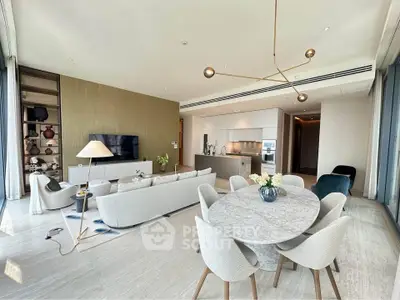 Luxurious open-plan living and dining area with modern furnishings and elegant decor.