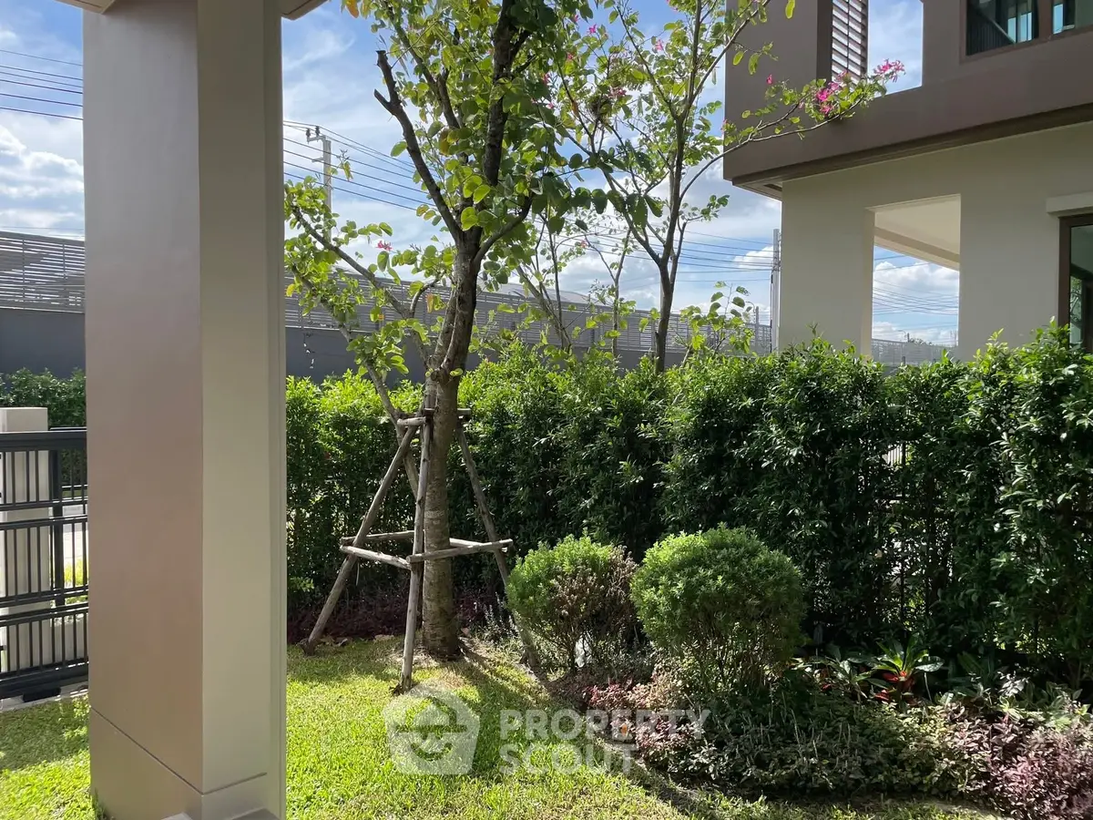 Charming garden view with lush greenery and modern architecture