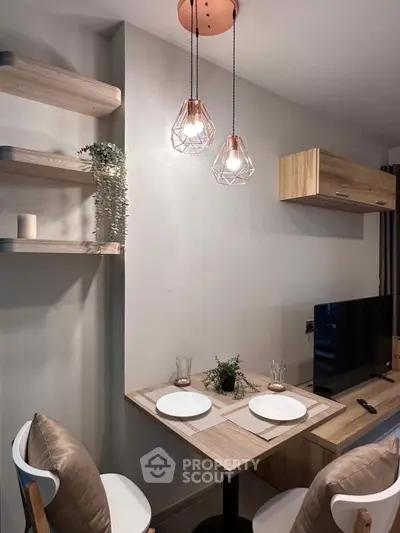 Cozy dining nook with modern lighting and stylish decor