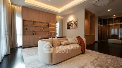Luxurious modern living room with elegant decor and cozy seating in a stylish apartment.