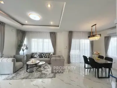 Luxurious modern living room with elegant dining area and stylish decor