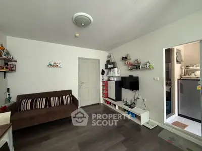 Cozy living room with modern decor and open kitchen view