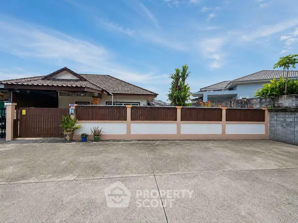 Charming suburban home with spacious driveway and modern exterior design.