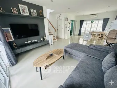 Spacious modern living room with stylish decor and open dining area
