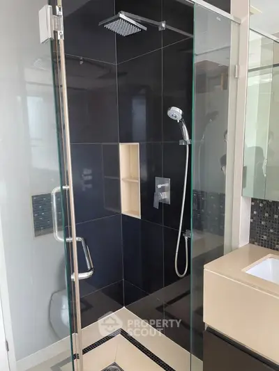 Modern bathroom with sleek glass shower and contemporary fixtures