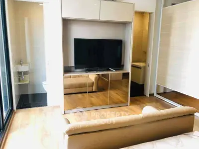 Modern living room with sleek TV setup and stylish furnishings