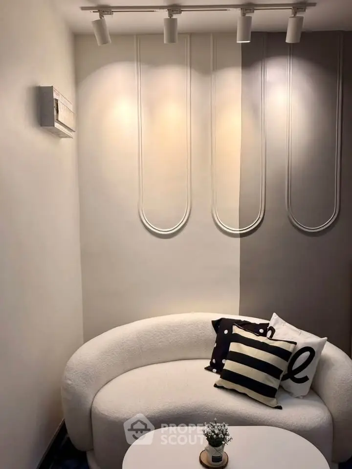 Stylish modern living room with cozy white sofa and decorative pillows