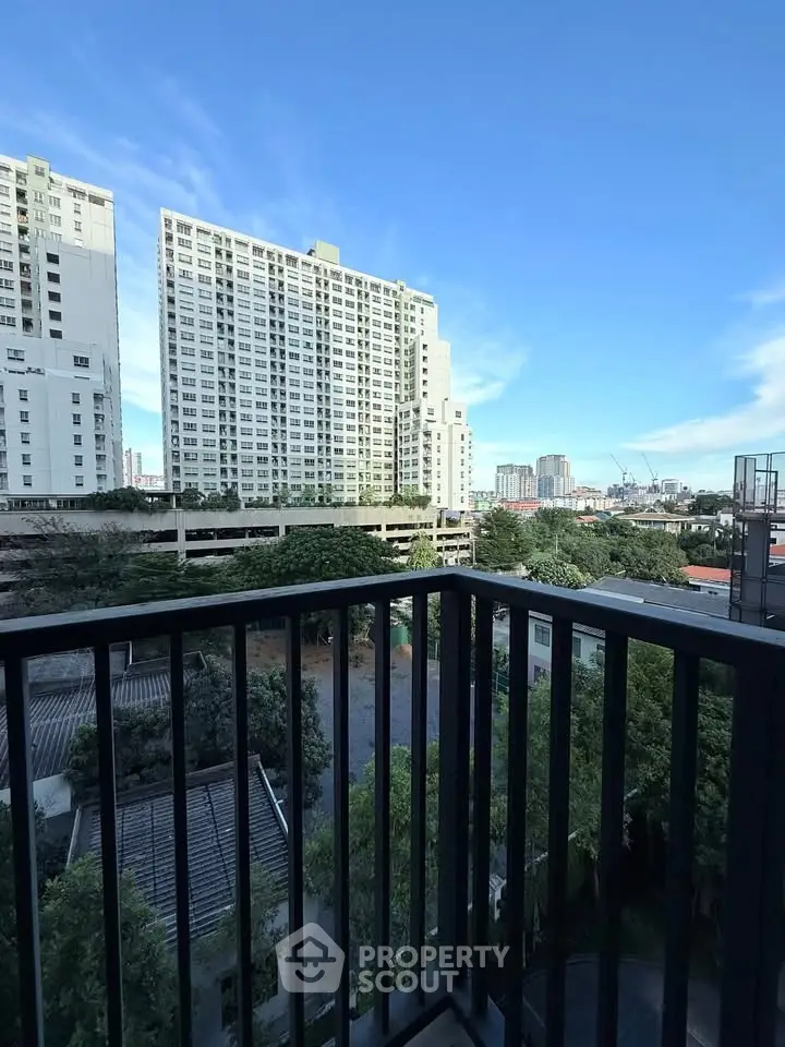 Stunning cityscape view from a modern balcony, perfect for urban living enthusiasts.