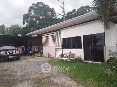 Charming single-story home with spacious outdoor area and ample parking space.