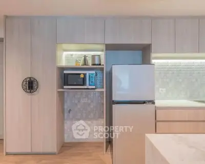 Modern kitchen with sleek cabinetry and built-in appliances