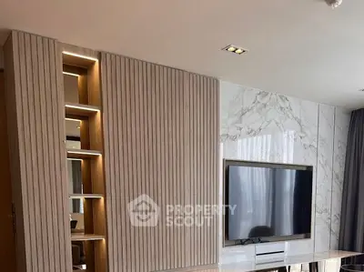 Modern living room with marble accent wall and built-in TV unit
